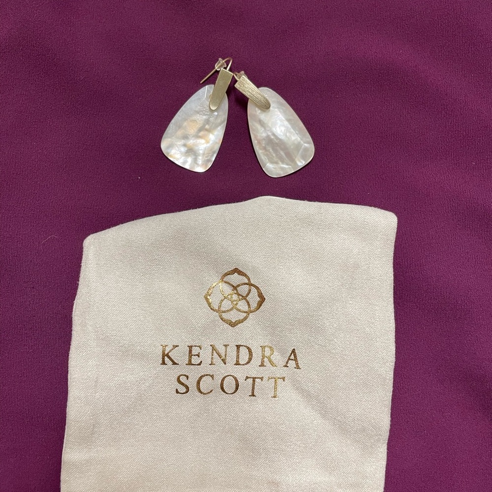 Kendra Scott ivory mother of pearl with gold earrings.